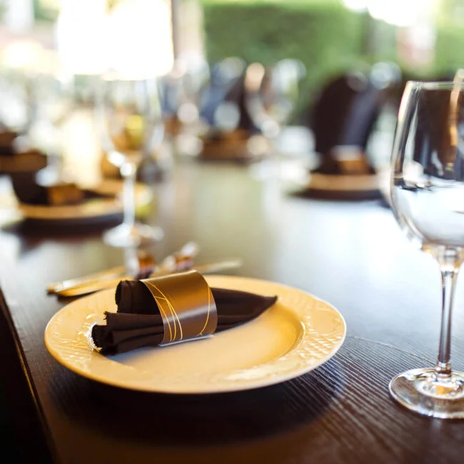 sparkling-glassware-stands-on-long-table-prepared-2023-11-27-04-50-35-utc-650x650